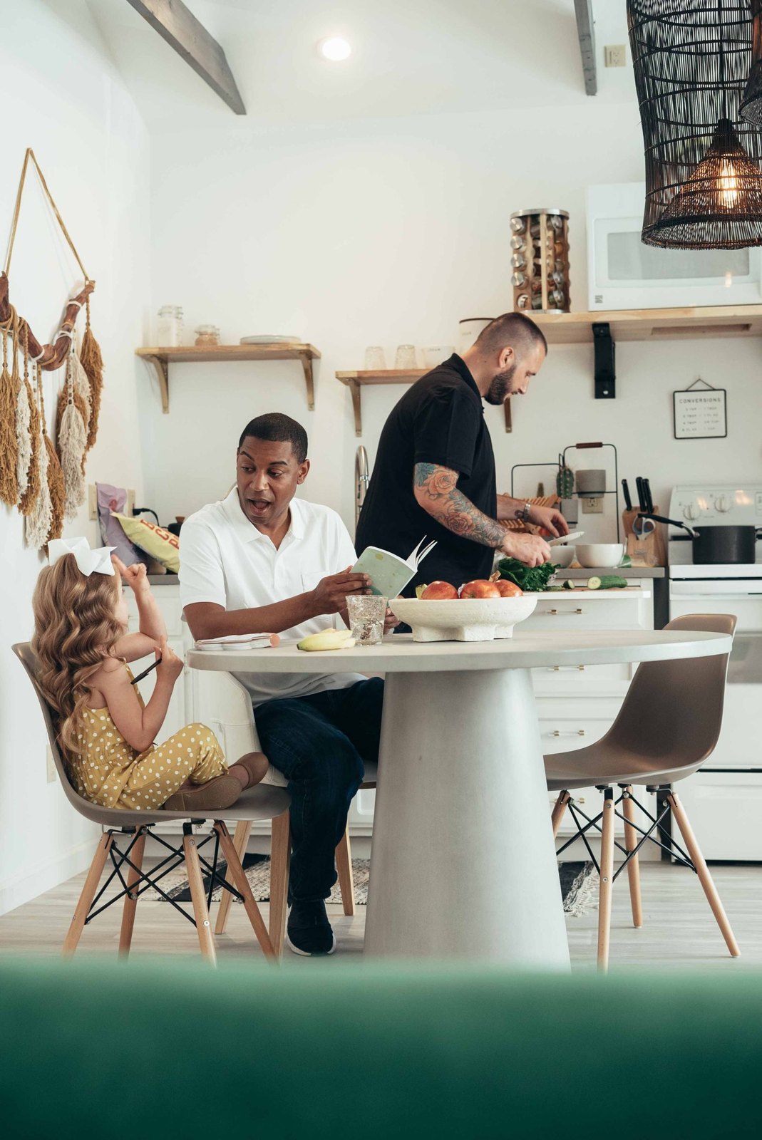 A father talking to his daughter while at the dining table