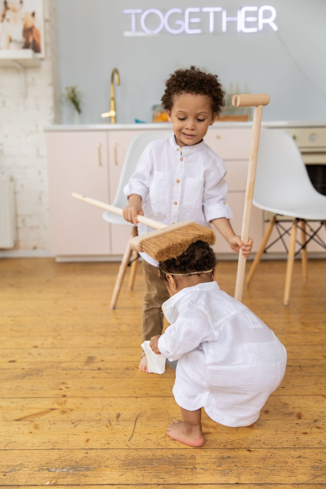 Child holding a sweeper