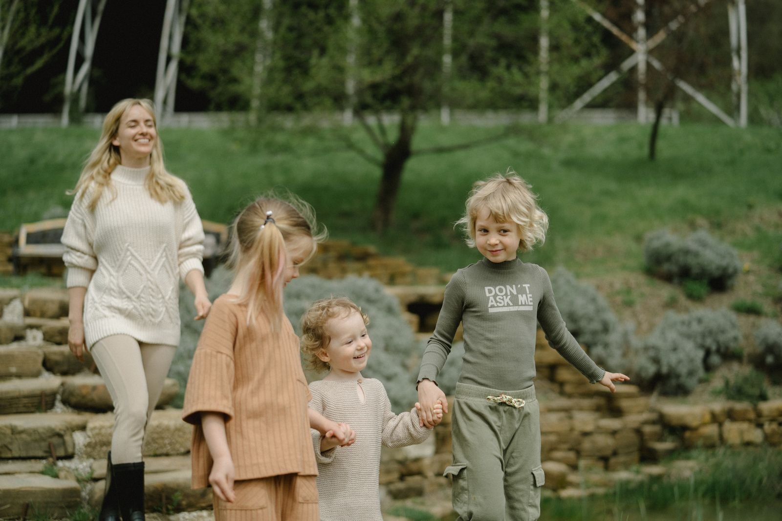 Children walking while holding hands