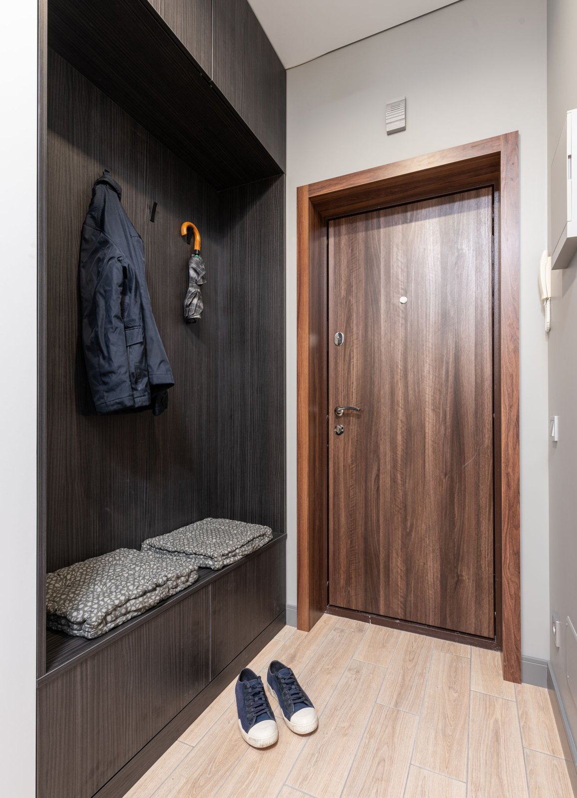Interior of hallway with hangers near door