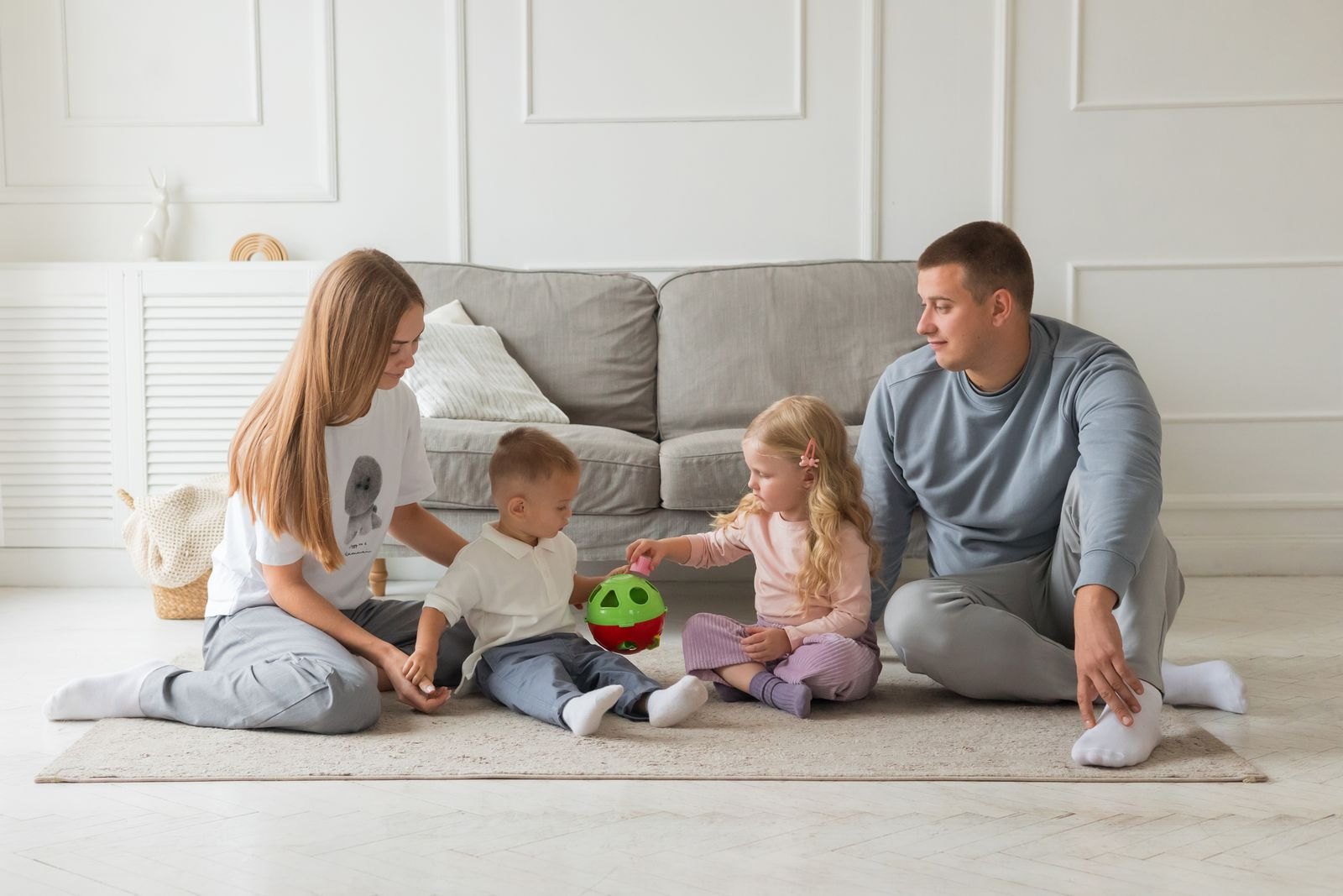 Happy family playing together in cozy living room