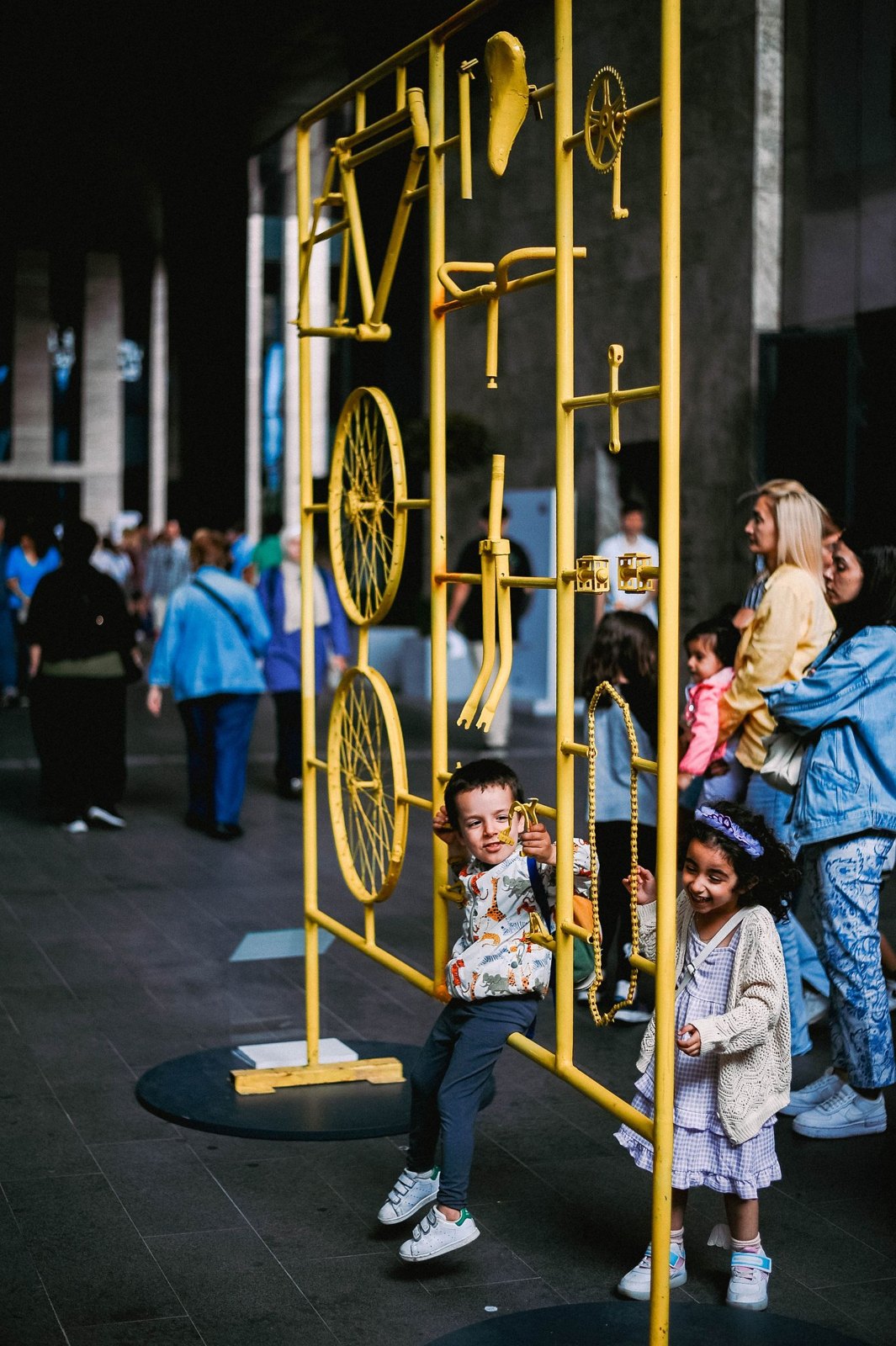 Children next to an exhibit in a modern museum