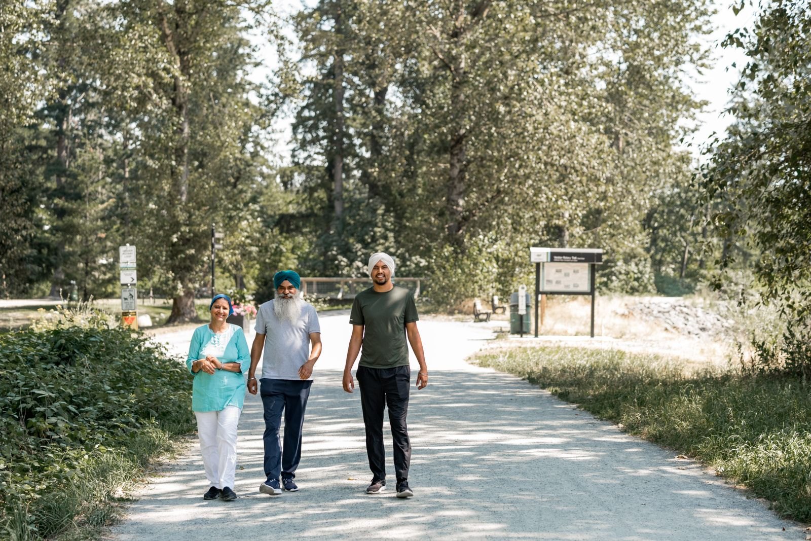 Family walking along a shaded path