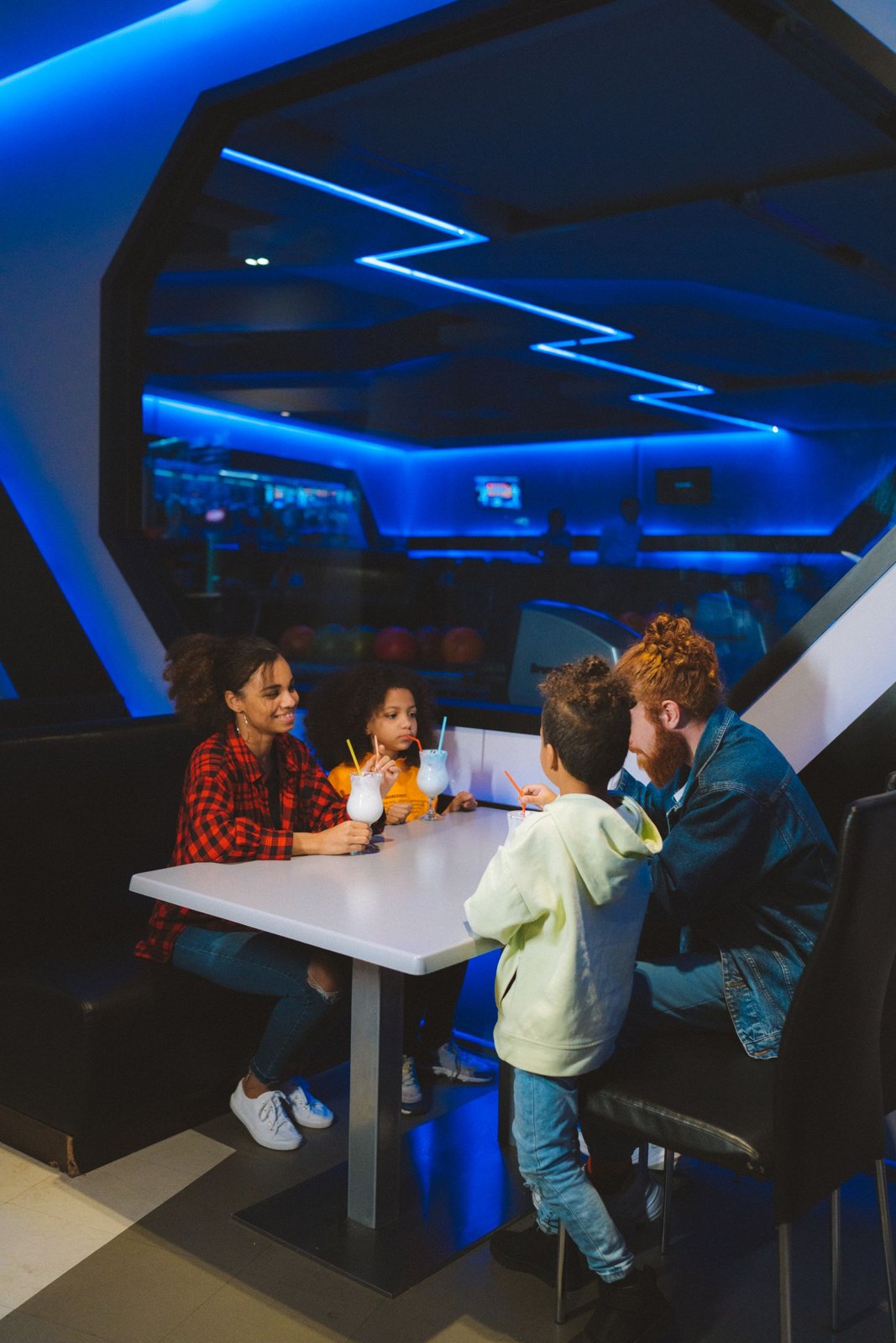 Family sitting together at a restaurant table
