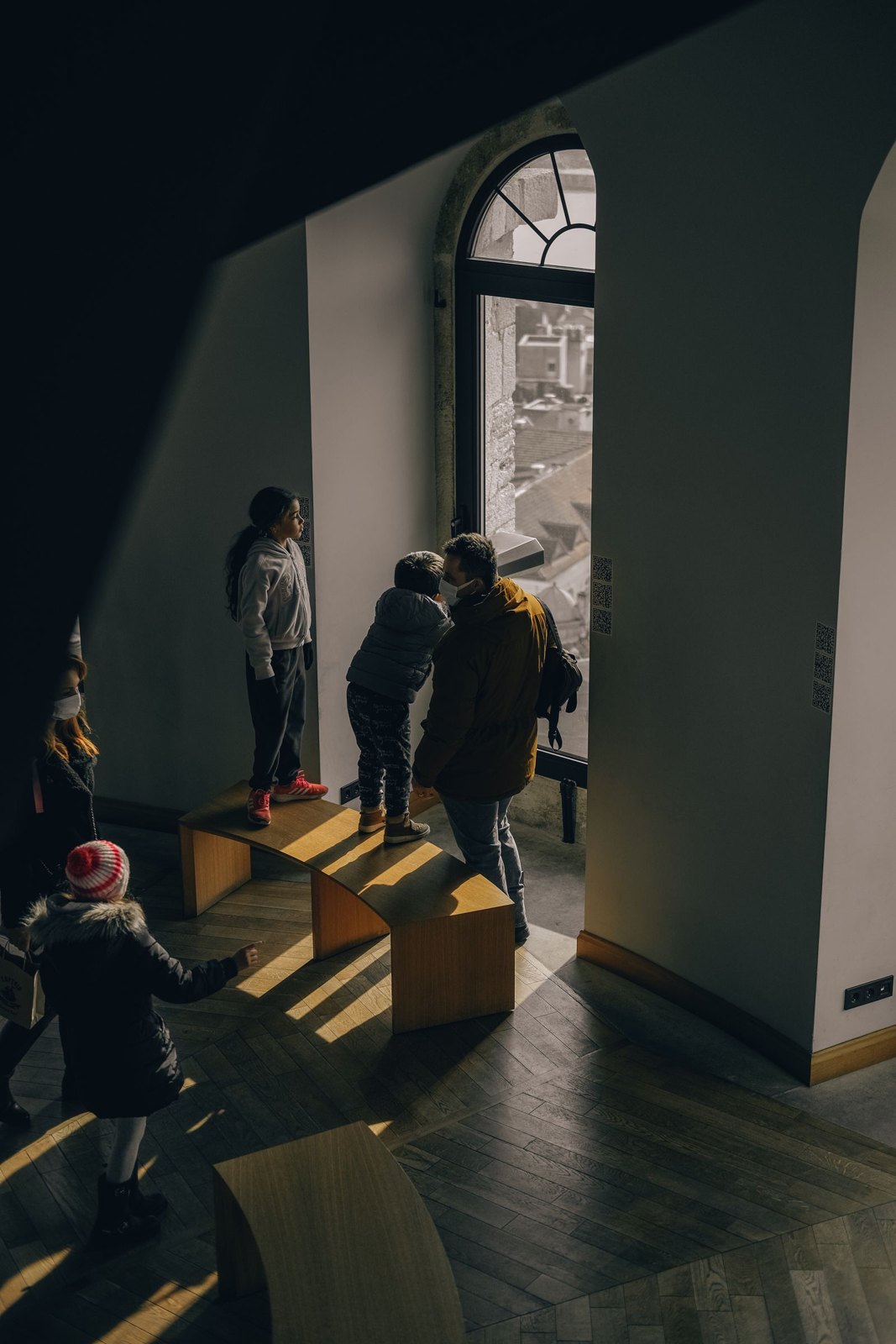 Tourists with children in museum